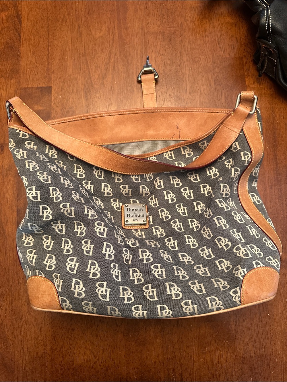 Dooney & Bourke Brown and Tan Logo Canvas Messenger Bag w/some pen marks inside